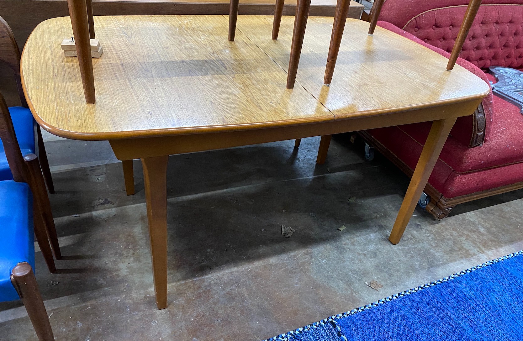 A mid century design teak sideboard, length 182cm, depth 47cm, height 79cm and extending dining table